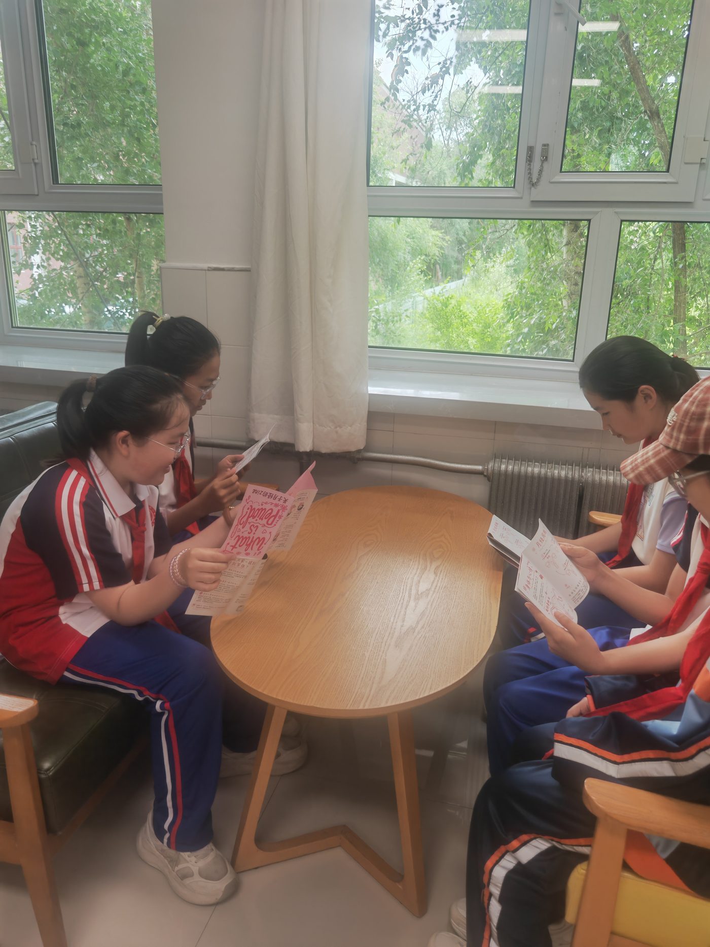 Two students reading the zine in Hailar, Inner Mongolia